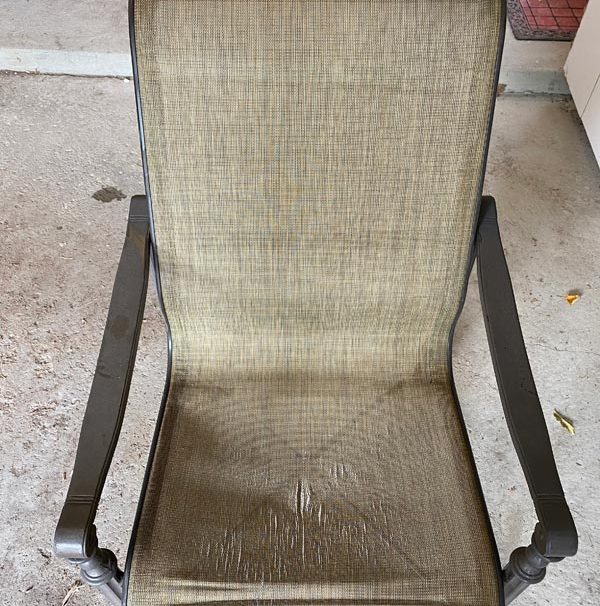 Damaged sling chair upholstery