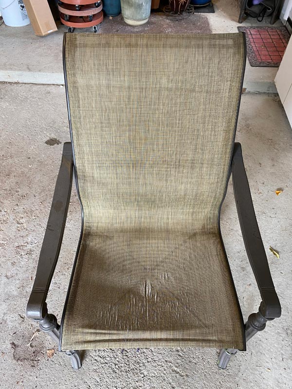 Damaged sling chair upholstery
