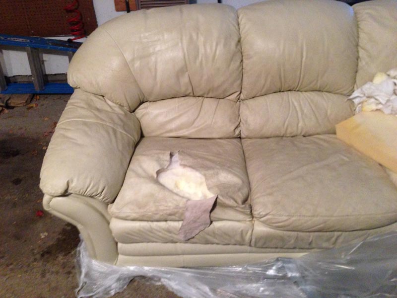 This lovely leather couch suffered some serious pet damage
